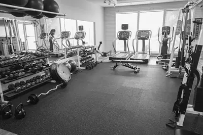 Main gym floor: free weights, cardio by the windows and cable stations